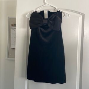 Gorgeous black velvet holiday dress with statement satin bow